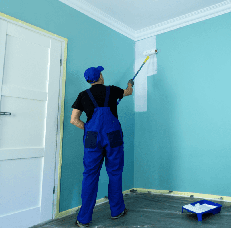 MCK Maintenance decorator painting a wall